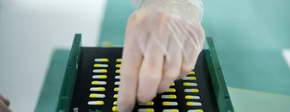 hand with a pill tray